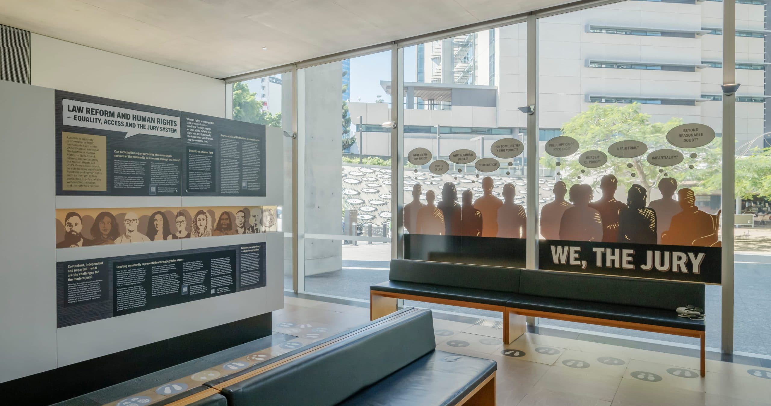 We, The Jury exhibition interior view of display wall and glass artwork
