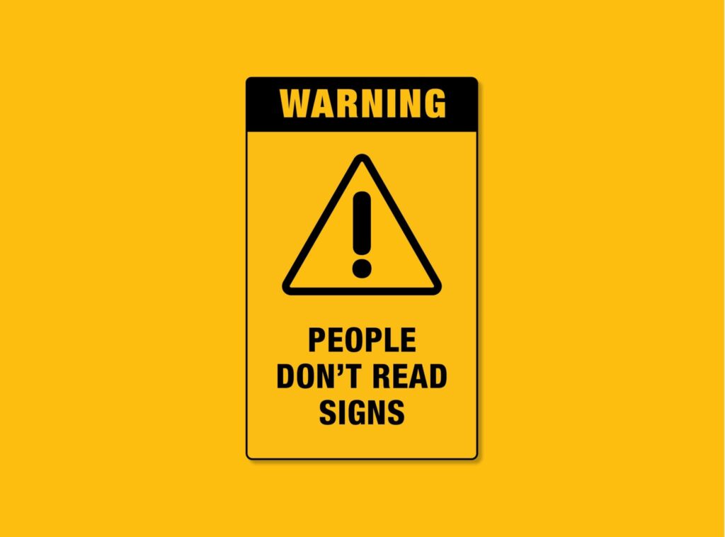 Sign that reads 'Warning! People don't read signs'